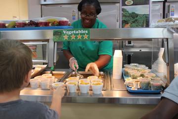 Child Nutrition staff serves lunch at Sudduth Elementary